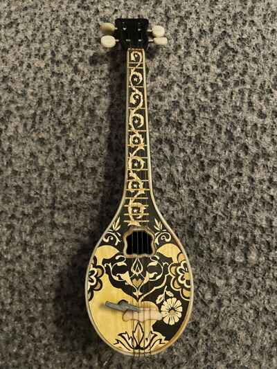 Small vintage retro old 1970??s wind up mandolin plays tune