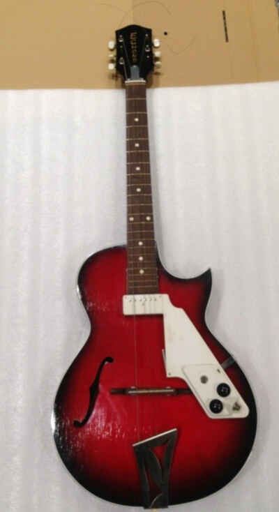 A old red Egmond Electro Acoustic Guitar from the 1960s